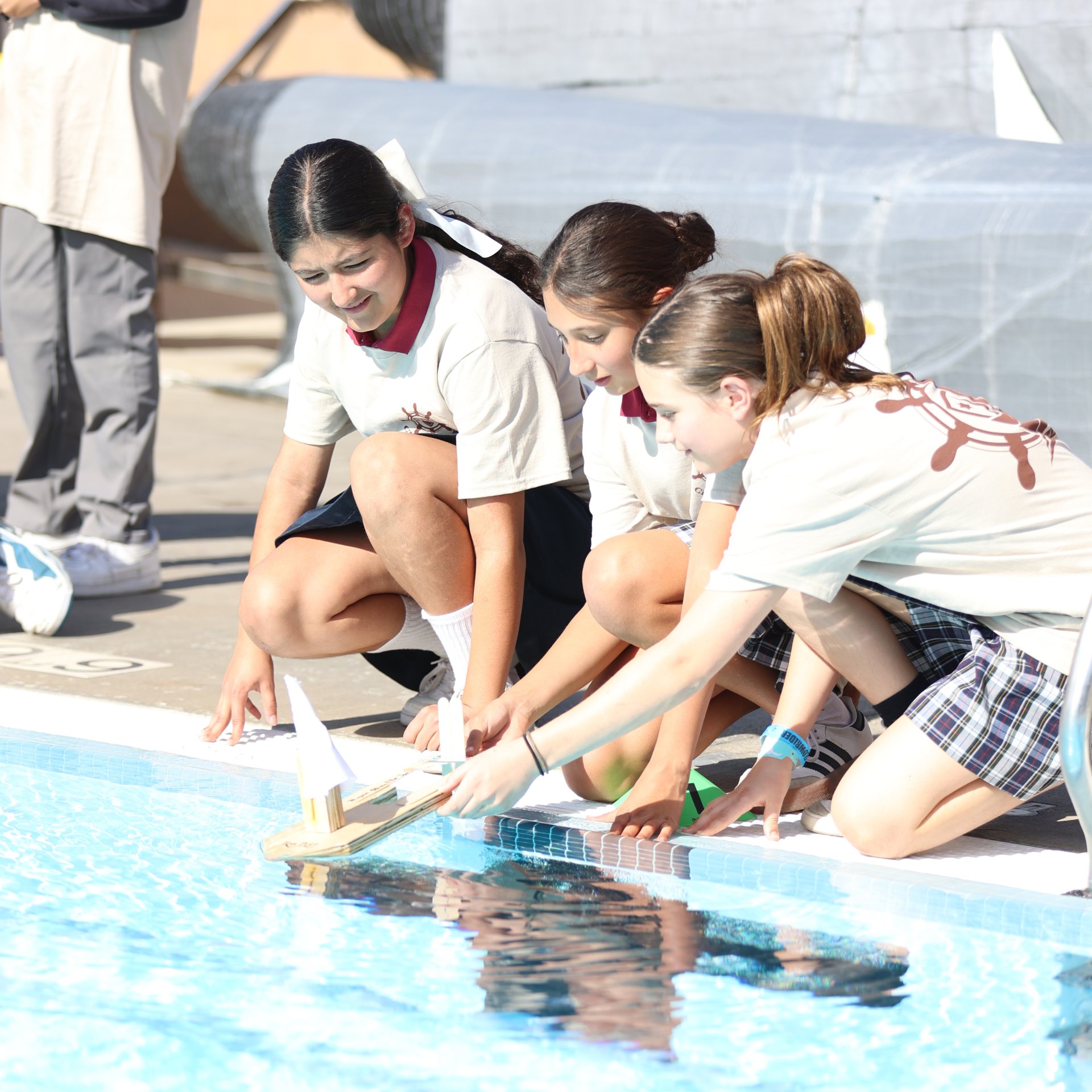 Sliding their boat into the water, ready to race!